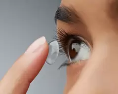 soft contacts placed in woman's eye