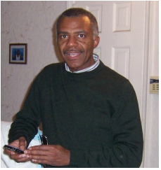 Lloyd A. Green smiling for the camera when asked about The Green Legacy