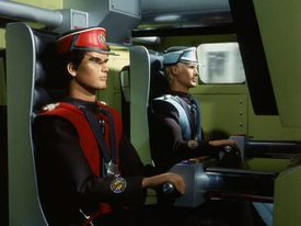 Captain Scarlet and Captain Blue puppets in vehicle
