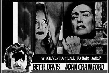 Joan and Betty behind window next to broken doll